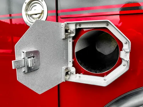 Second open fill-port door close-up showing intake opening and latch.